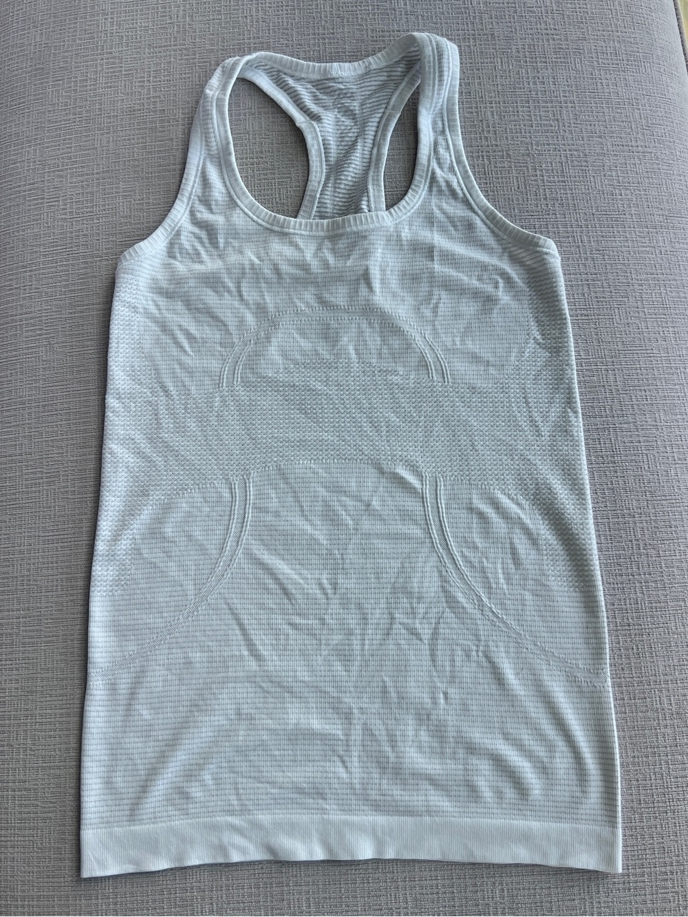 Like new white lululemon swiftly tank sz4